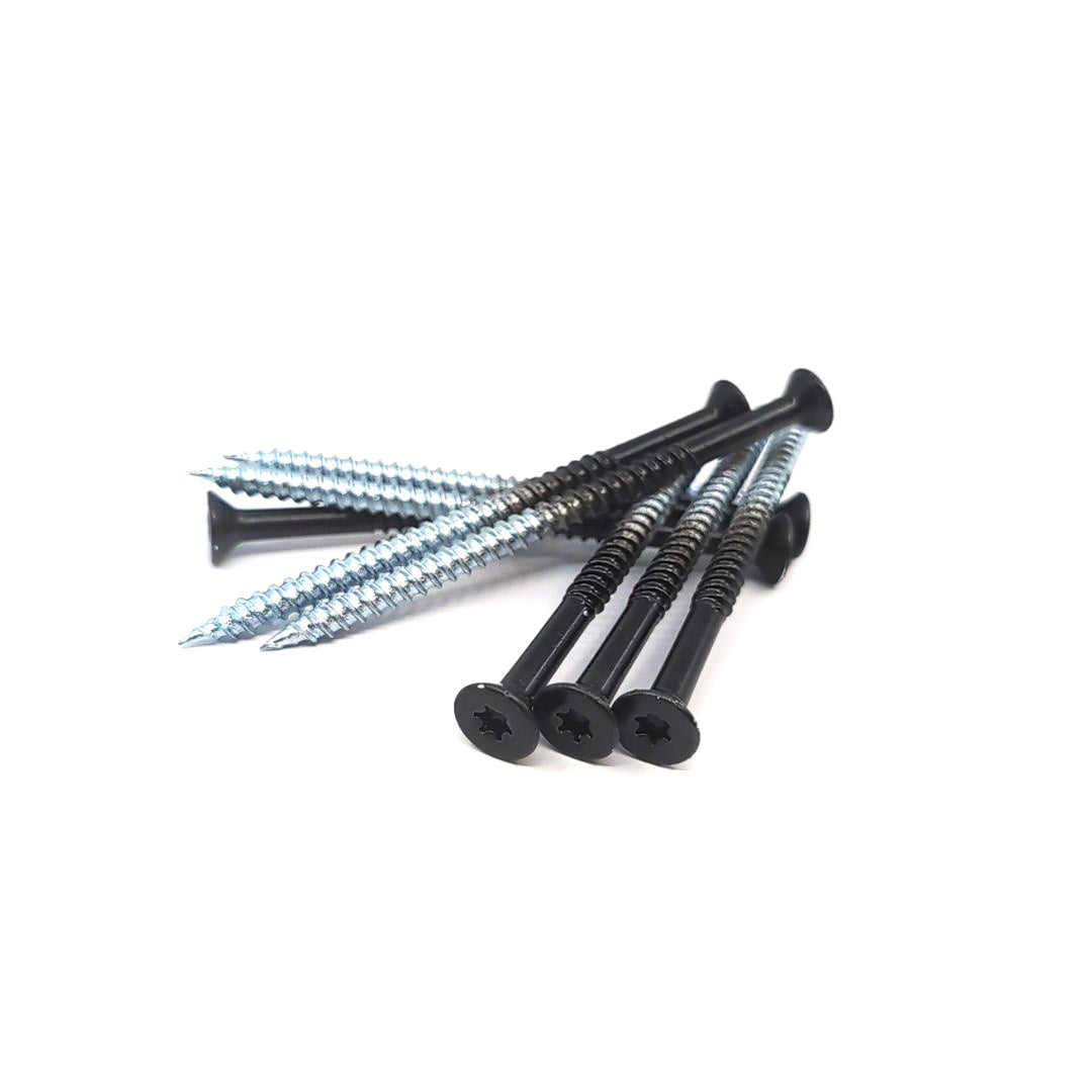 A set of #14x4 Black Flat Head Screws (8pcs) is displayed on a white background, featuring four black screws with ACQ Compatible Coating and sharp tips, alongside four shiny silver screws, arranged in an artfully scattered manner.