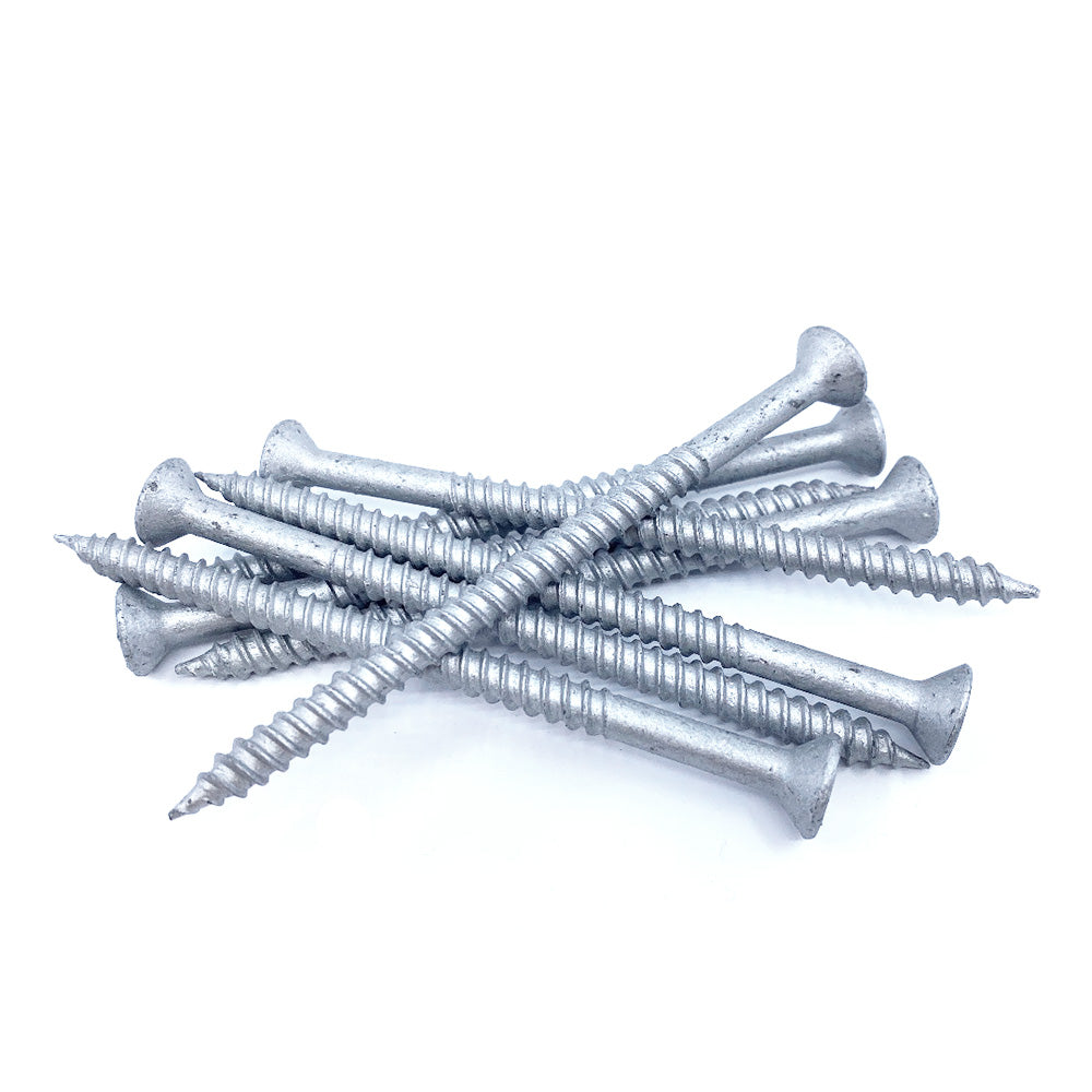 A set of #14x4 Galvanized Flat Head Screws with Master Gripper threads is scattered on a white background, each designed for Six Lobe T-27 Drive for superior rust protection.