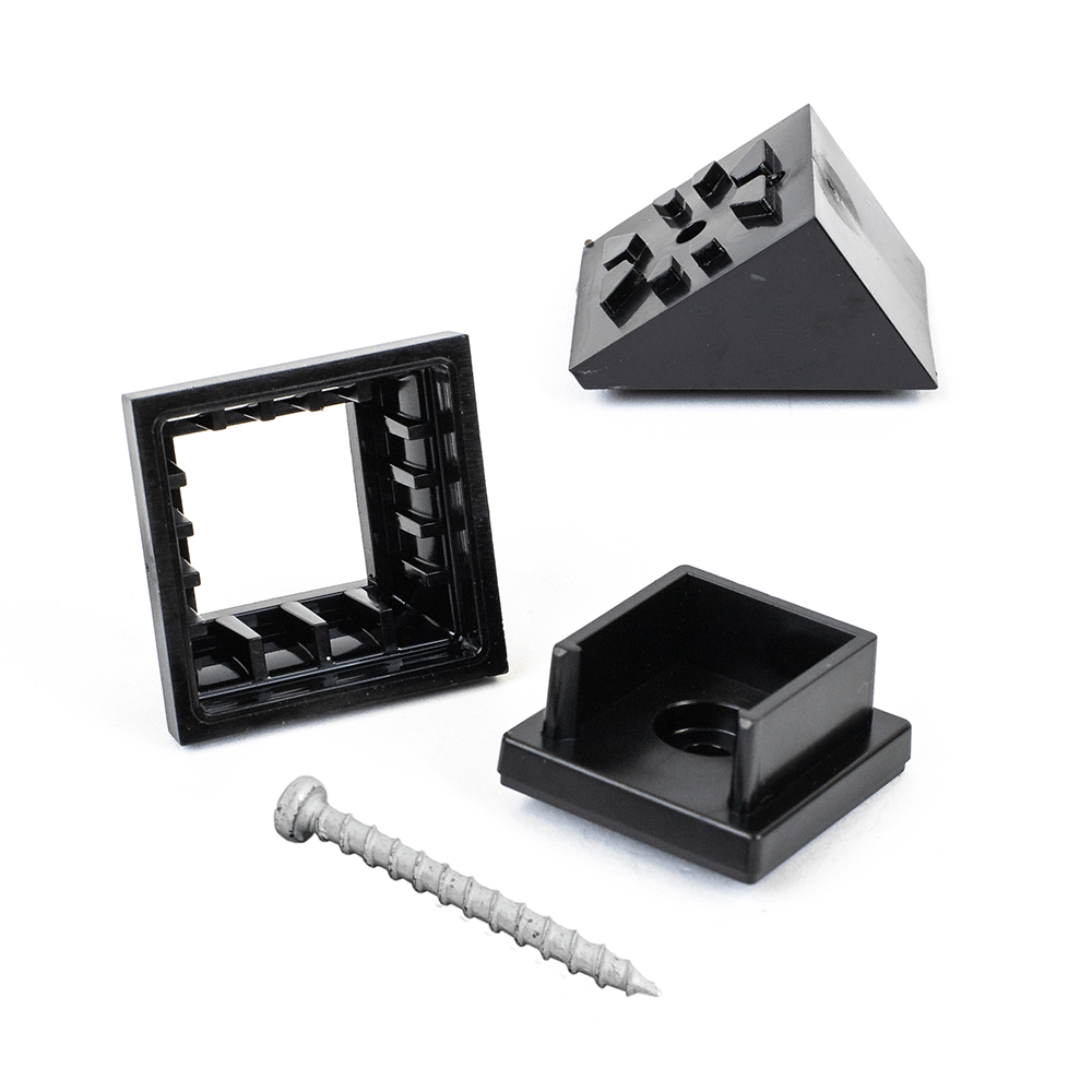 Four black plastic objects, featuring two open frame pieces, a studded triangular block, and a square block with a hole. A metal screw is in the foreground with Snapn Lock® Stair Adapter Plus Connector Packs for seamless assembly.
