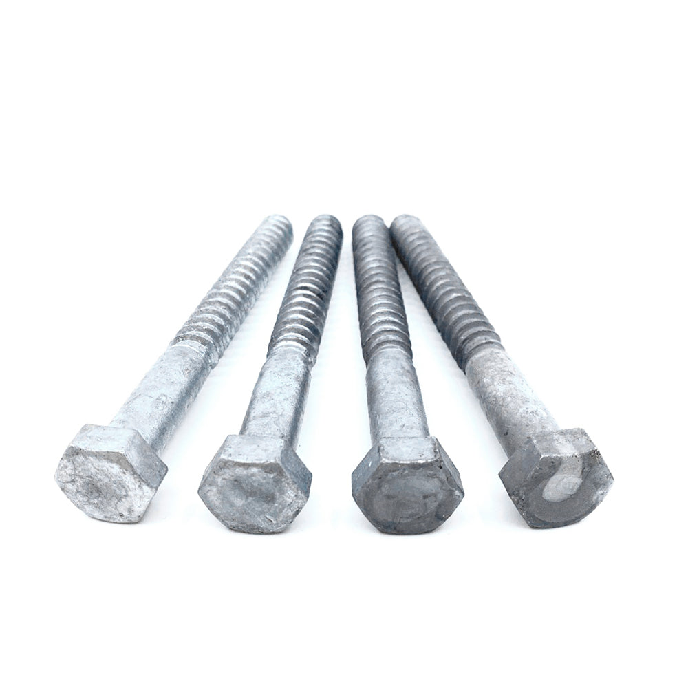 Against a plain white background, four 1/2x5 Galvanized Hex Head Lag Screws showcase their durability and strength, ideal for use with Titan Wood Post Anchors.