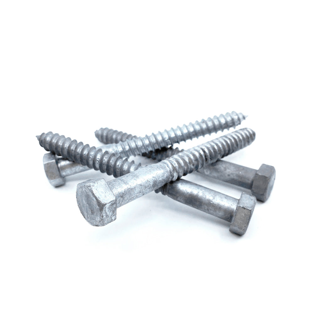Four 1/2x5 Galvanized Hex Head Lag Screws are arranged in a crisscross pattern against a white background, showcasing their metallic hex heads with threads running most of their length.