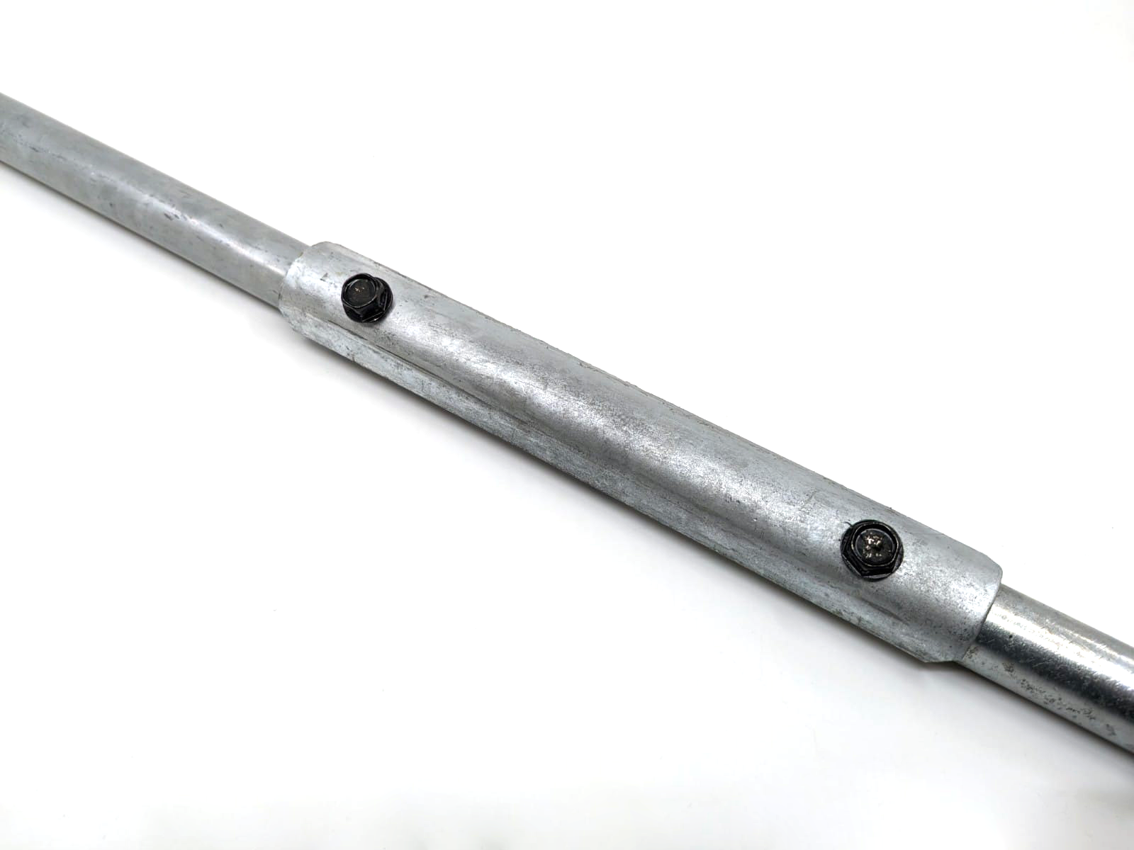 A close-up of the Auger Extension reveals two bolts and an M16 2.0 thread. The cylindrical metal device is silver and displayed horizontally against a plain white background.