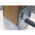 The 1/4x3 galvanized hex head lag screw is being driven into a wooden post within a metal bracket, creating a sturdy connection essential for construction or DIY projects.