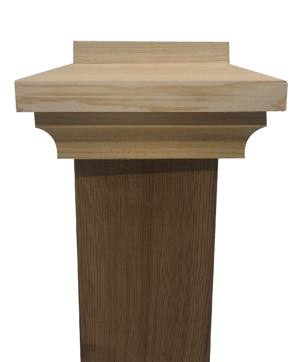 The Island Knotty Cedar Post Caps inspire a wooden podium with a flat top and decorative trim. It has a rectangular design in light knotty cedar, standing elegantly against a plain white background.