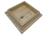A stack of square Island Knotty Cedar Post Caps sits against a black background. The top cap, with visible wood grain and a small knot, highlights the natural texture and hand-crafted look that emphasizes its minimalist design.