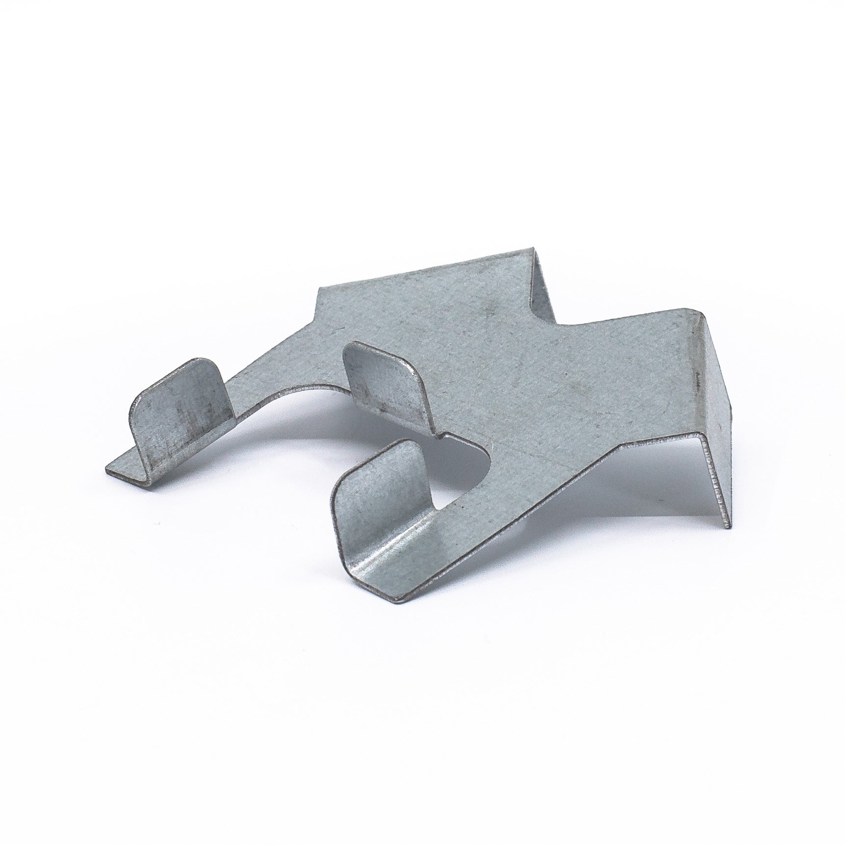 A small, metallic, angular clip with four protrusions on a white background resembles a Center Guide for Hole Saws. It has a shiny surface ideal for precise fastening and securely holding objects together.