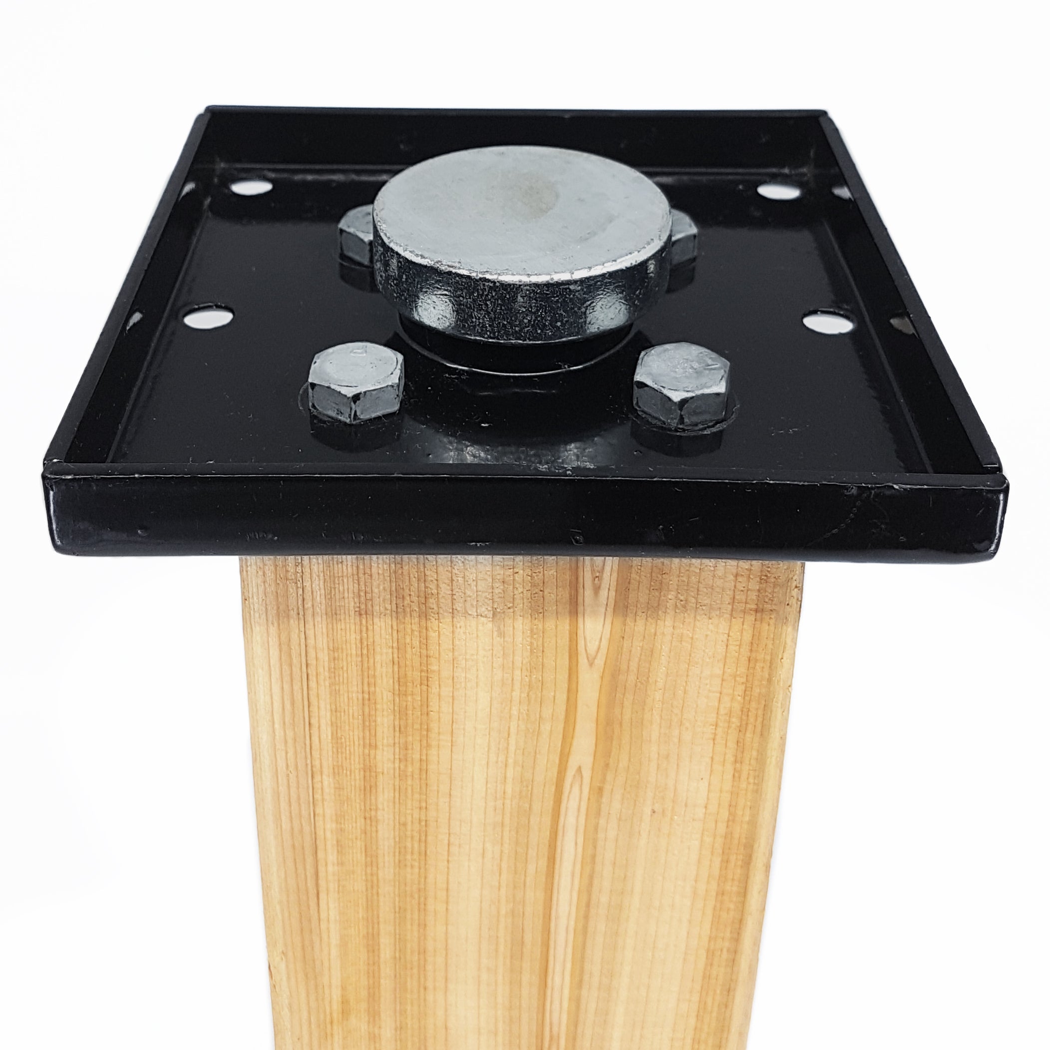 The Hammer Tool - 44 is a black metal adjustable 4x4 post base with a square plate for wooden beams. Ideal for builders, it includes bolts and a central round metal adjuster to fine-tune height. The background is white.