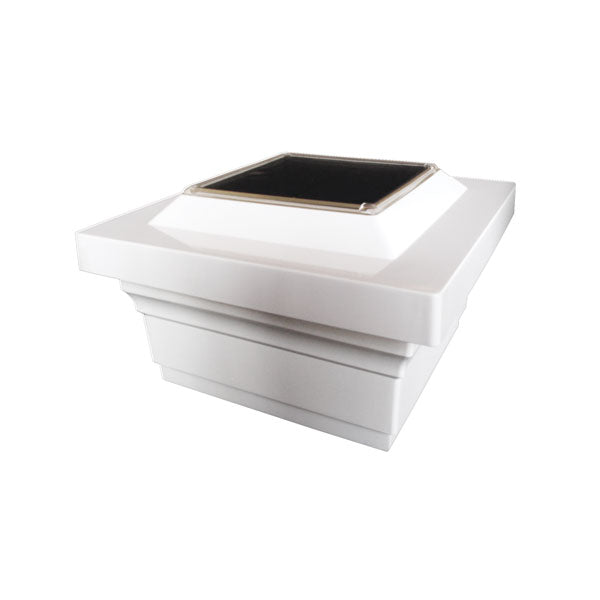 The Classy Post Cap Majestic Solar is a white, square outdoor lighting piece with a black solar panel. It features LED lights and layered design elements for a sleek and modern look, powered by rechargeable batteries.