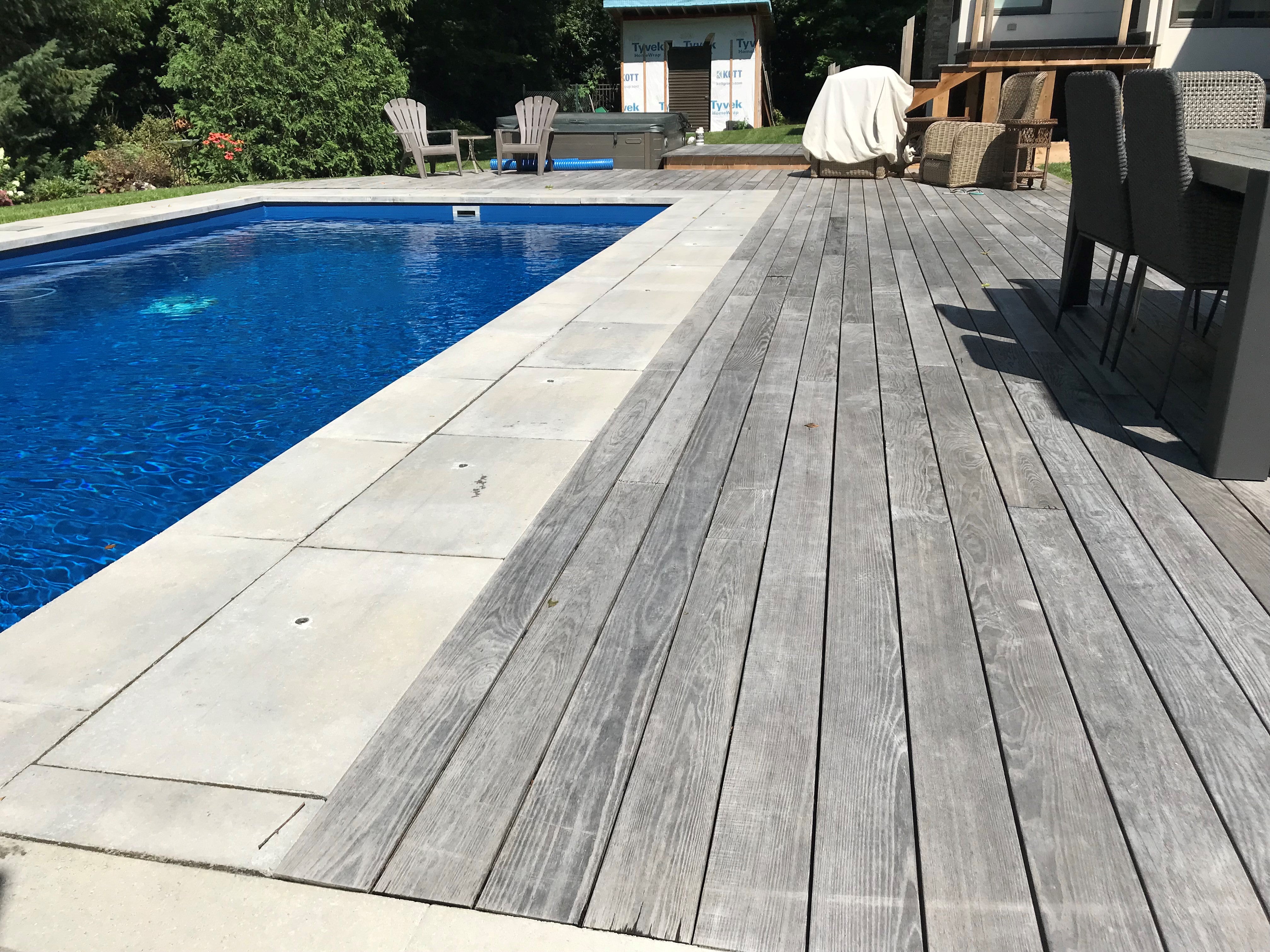 ground level poolside deck held up by the deck foot anchor