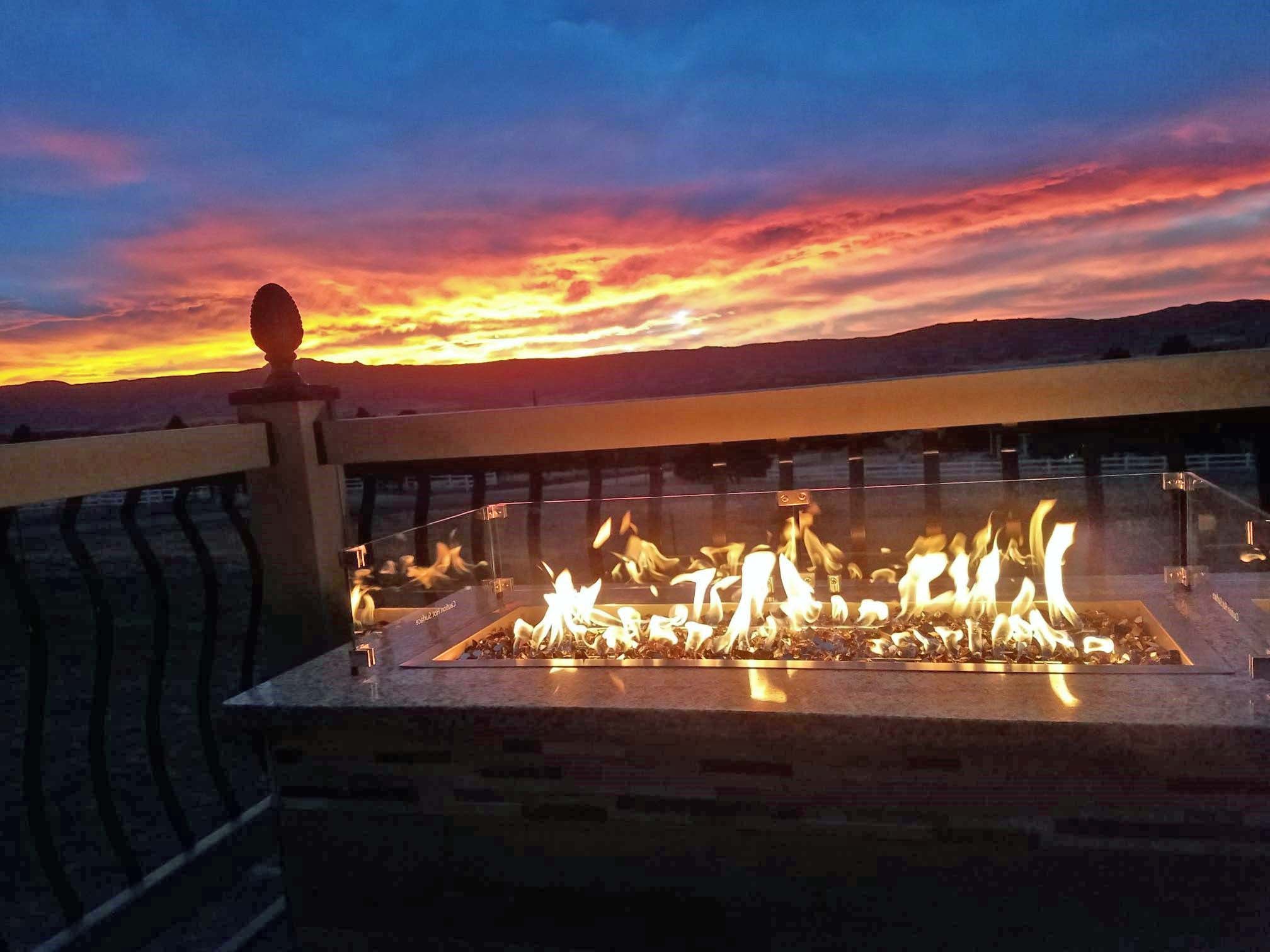 Fire pit with a stunning sunset view over mountains