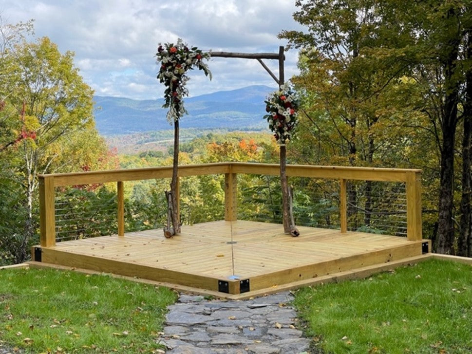 wedding deck in the mountains being held up by the deck foot anchors